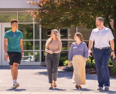 people walking together outside campus